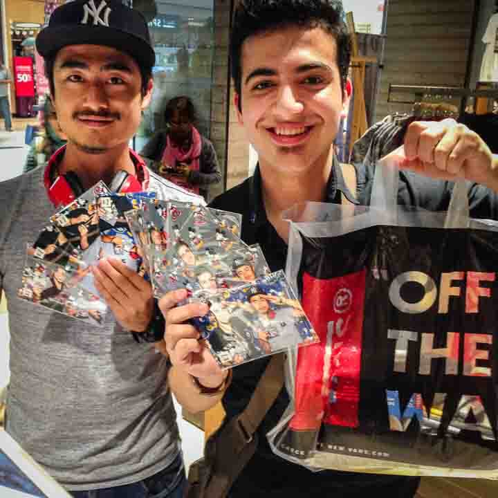 Snapshot-Photo-Booth-In-Store-Promotion Two young guys showing their photo booth photos in a Vans store in Yorkdale Mall in Toronto