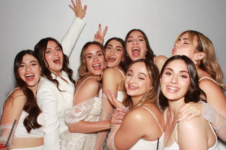 Snapshot-Photo-Booth-Wedding a bride and her bridesmaids having fun in the photobooth