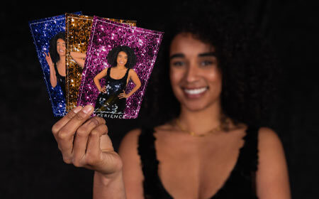 Paparazzi-booth a woman showing photo booth prints