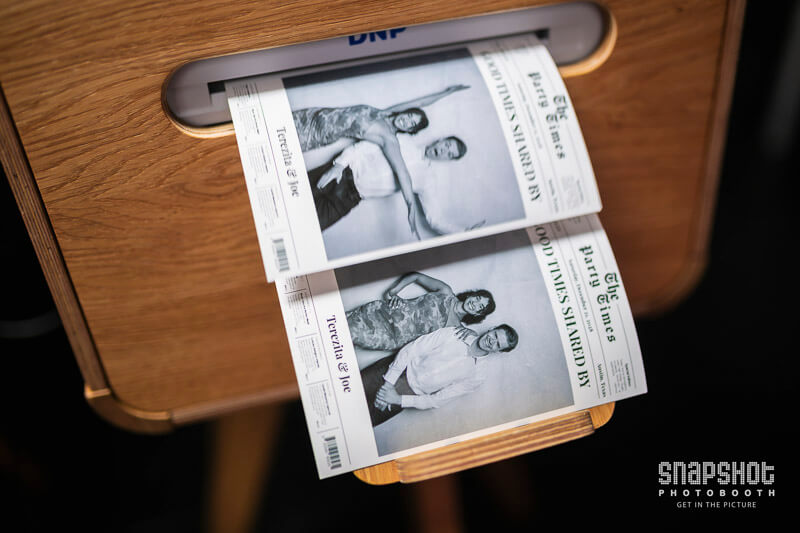 SPB-Newspaper-Experience-1747915746 newspaper photo booth prints coming out of a printer